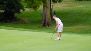 Putting, Joe puch competes at the Zanesville country club tournament. He is known around campus as a huge fan of the sport.